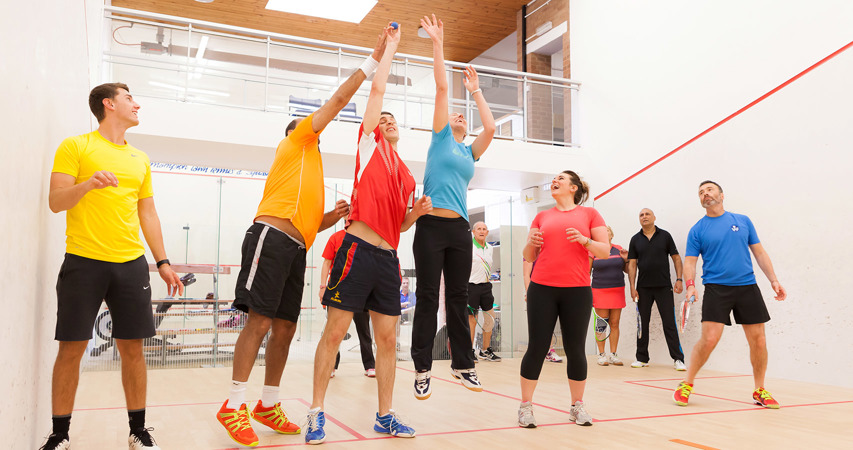 Players on a court playing Squash 101