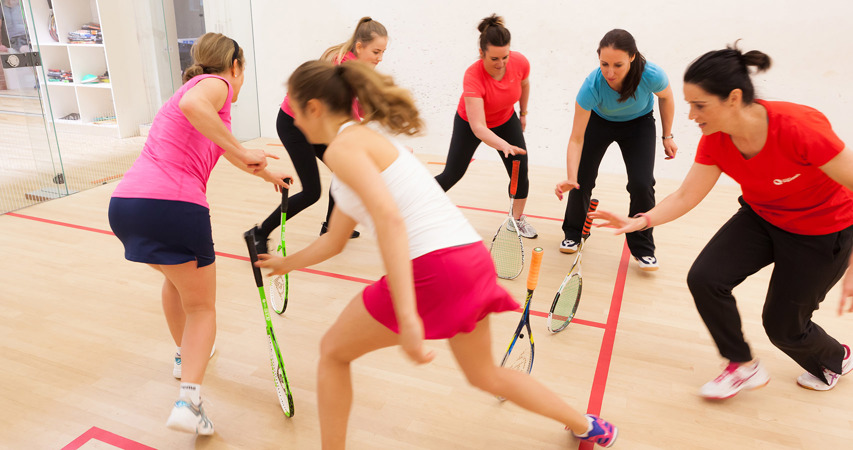 Women playing squash
