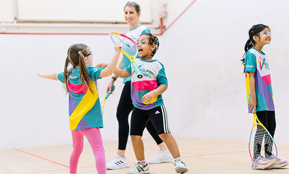 Female Coach Leading a childs squash session