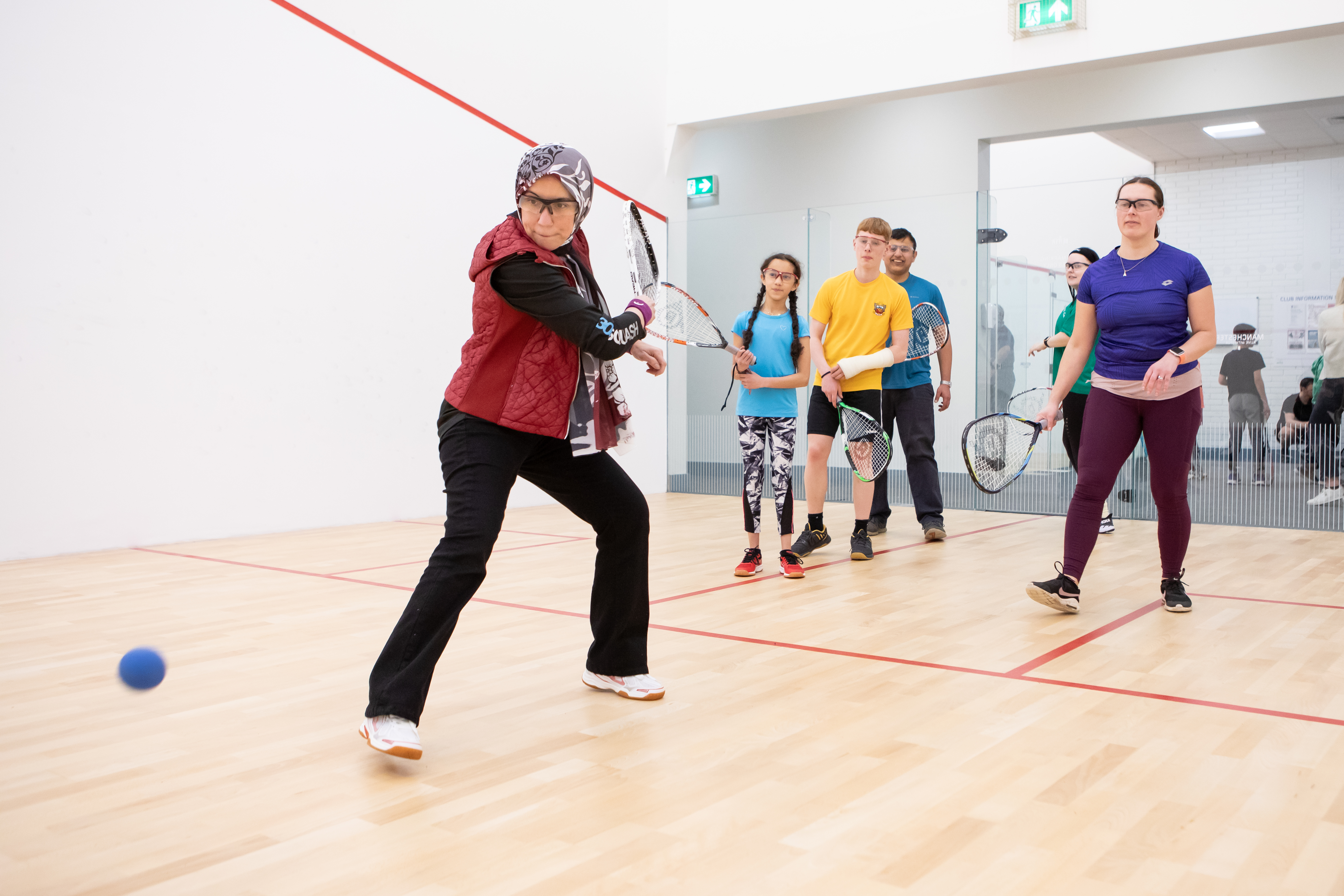 Group of players playing squash 57