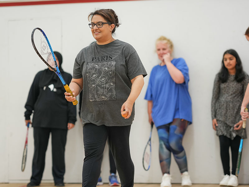 Women playing squash