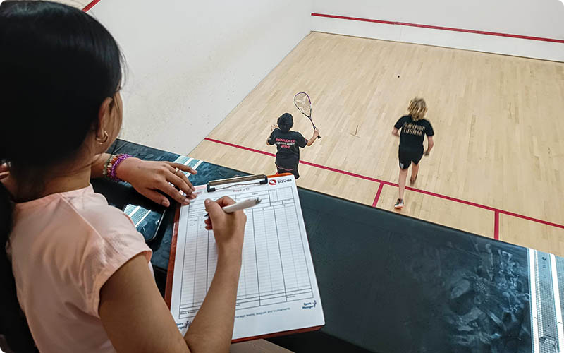 A girl marking a match