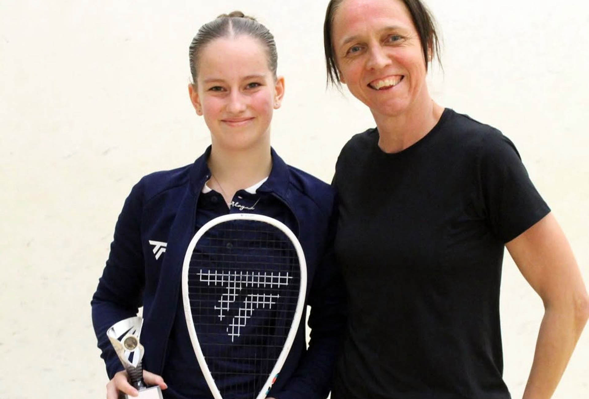 A winner of a recent Graded Tour event being pictured with England coach Tania Bailey