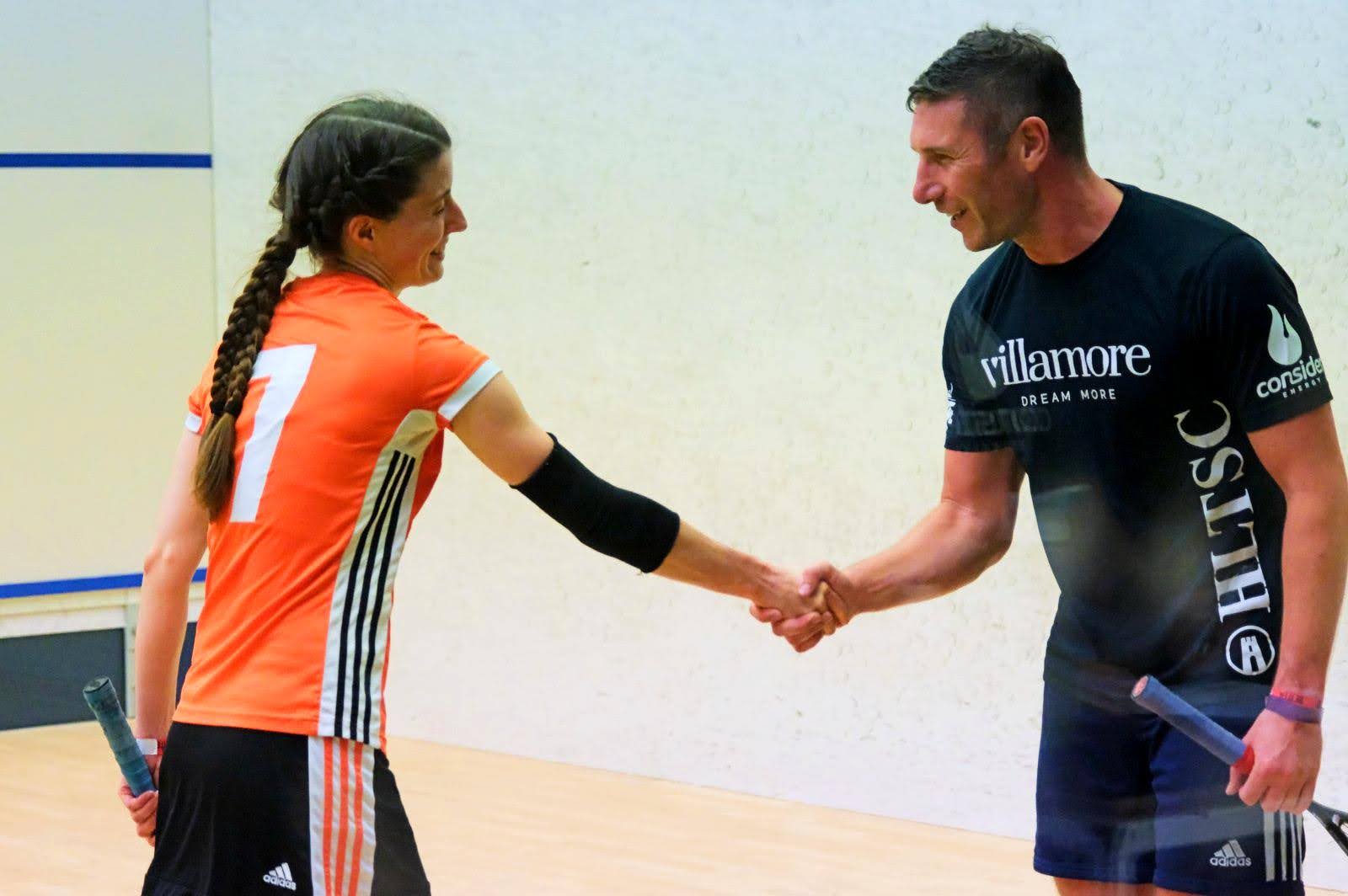 Man and Woman Playing Squash