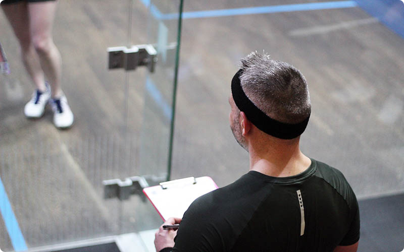 A man marking a squash match