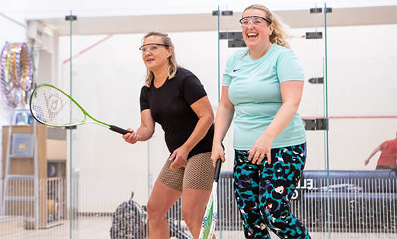 Women playing squash