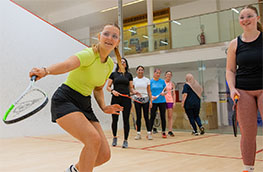 A group of women playing squash together