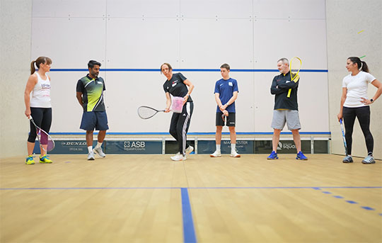 A squash coach leading an England Squash coaching course