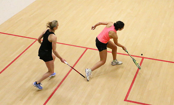 Two female players on court