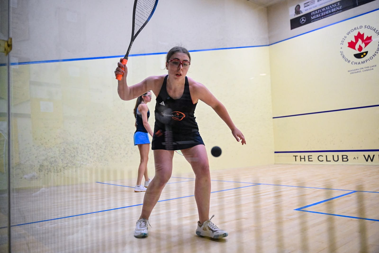 Emily Coulcher-Porter hitting a shot out of the corner at the World Junior Championships