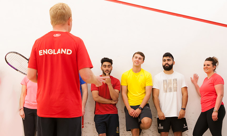 Coach coaching a group of players