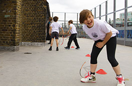 Children playing squash on a rooftop